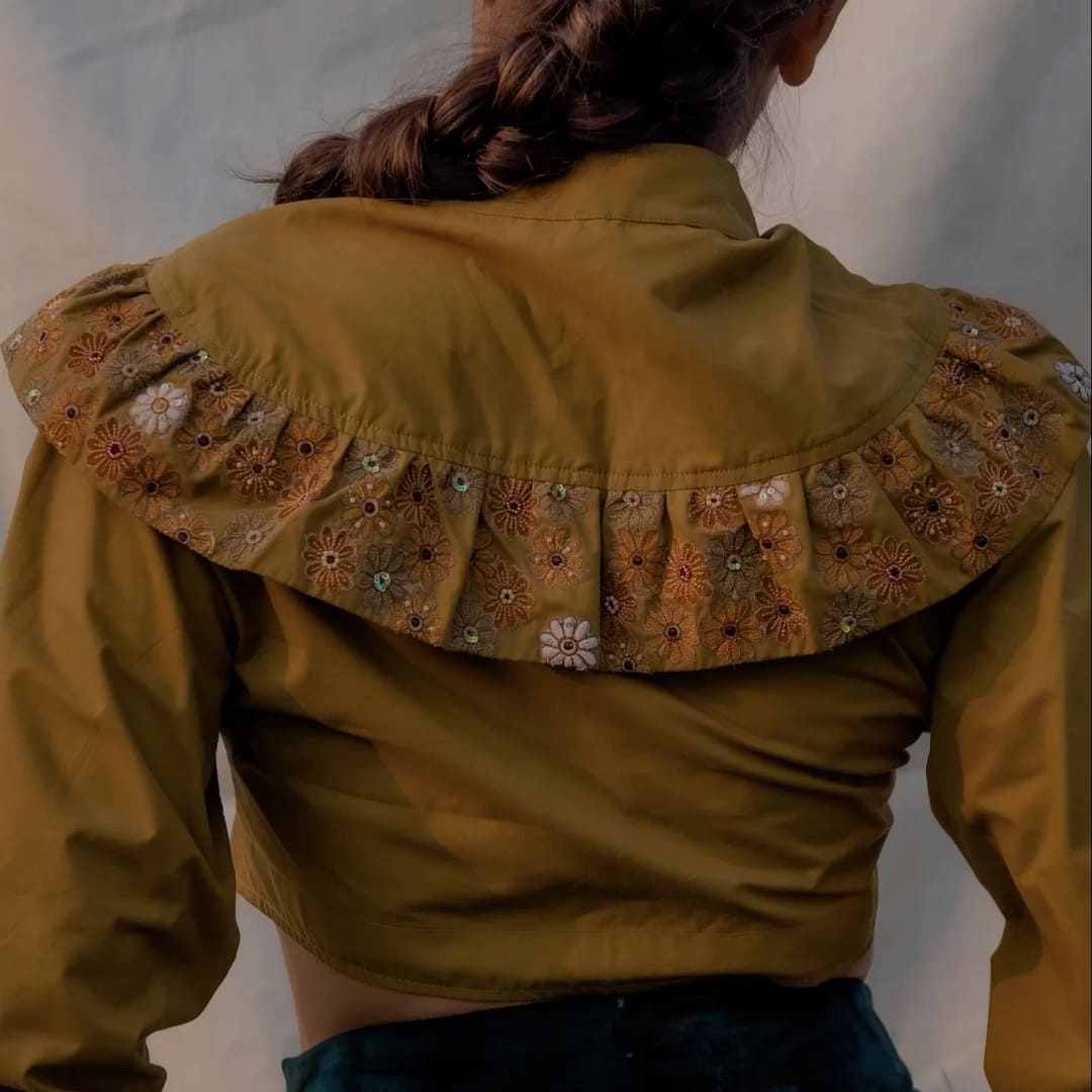 Indian Embroidery showcased on the back of Cropped Jacket